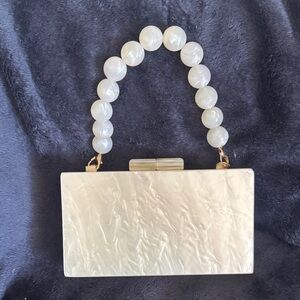 Elegant Cream Clutch with Beaded Handle